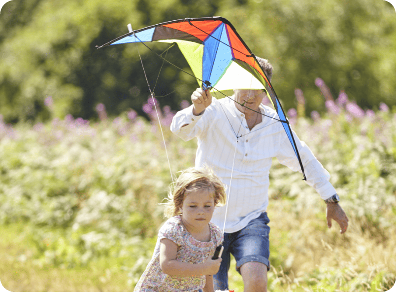 Man and child flying a kite